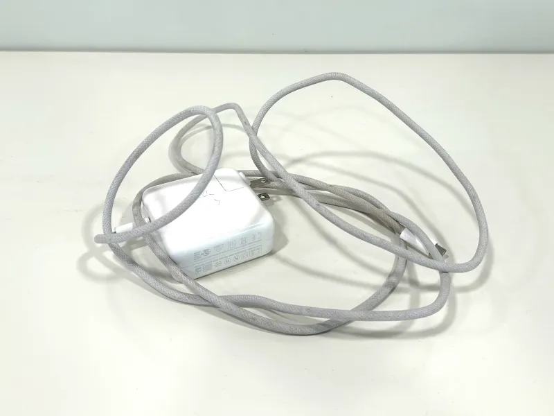 A discarded apple laptop charger