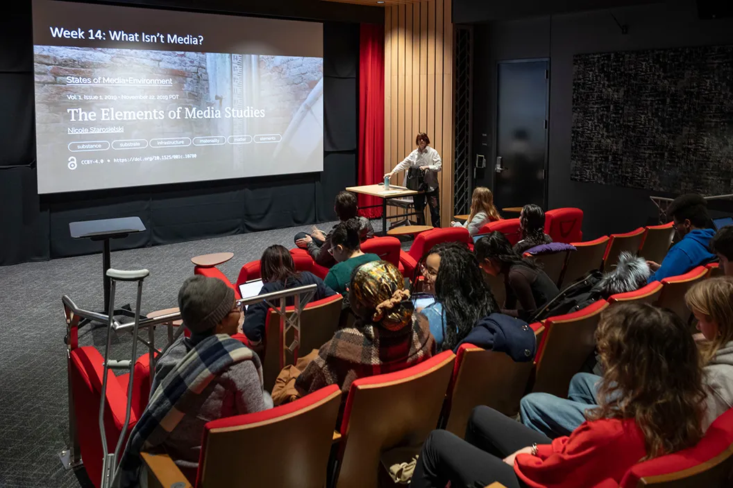 Students in film course attend screening in theater room