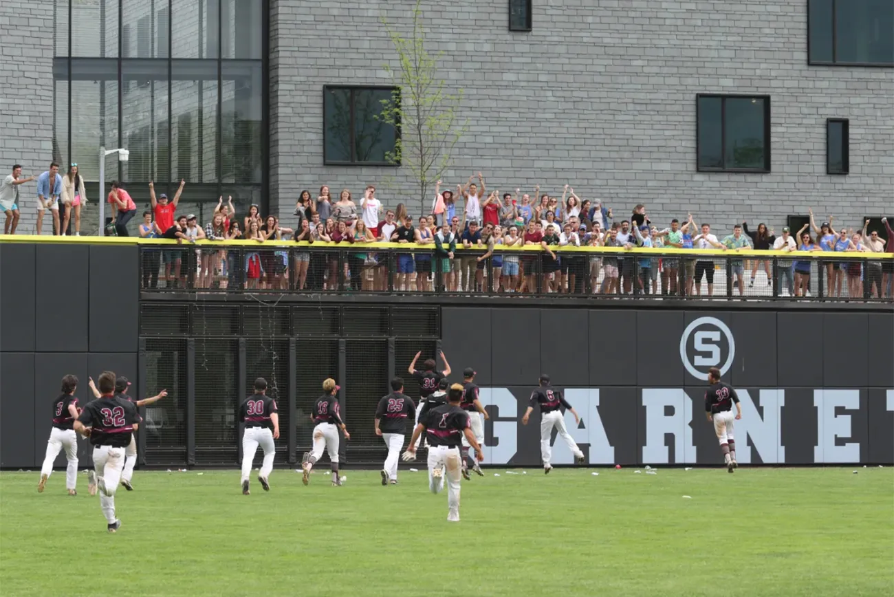 Athletes celebrate on baseball field