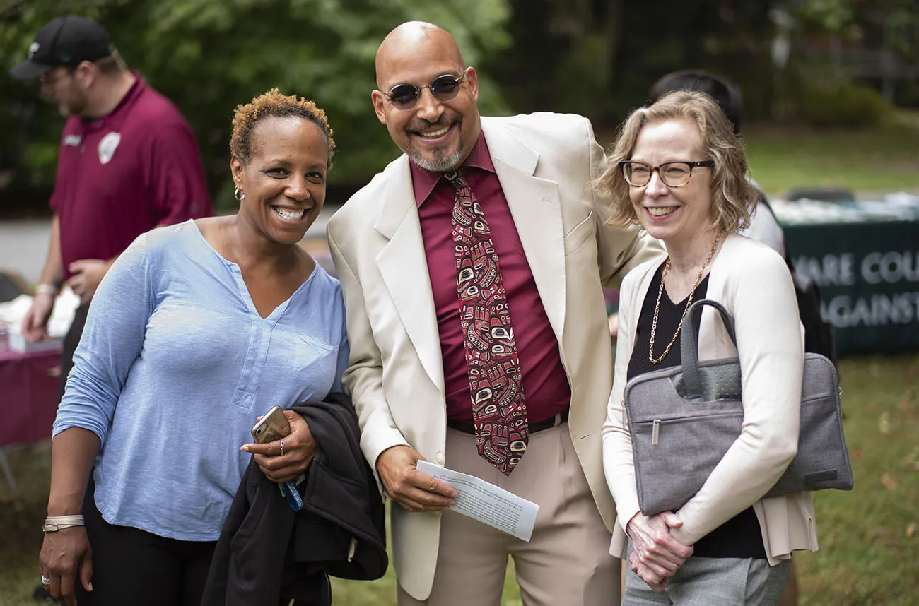 three staff employees at a picnic
