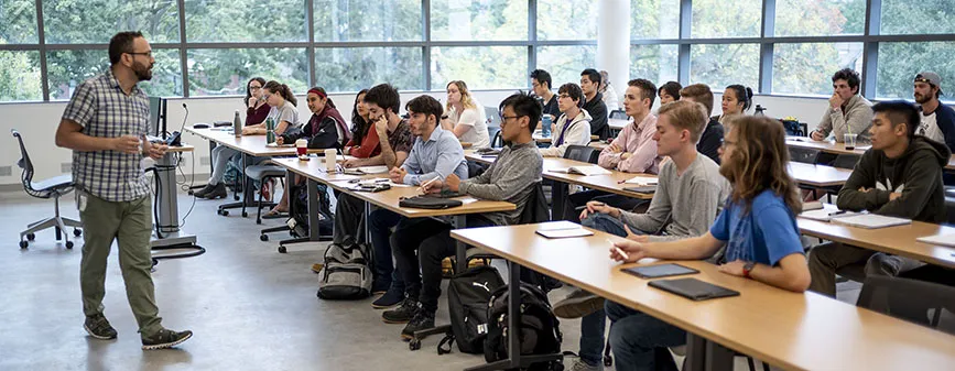 professor teaching students in a classroom