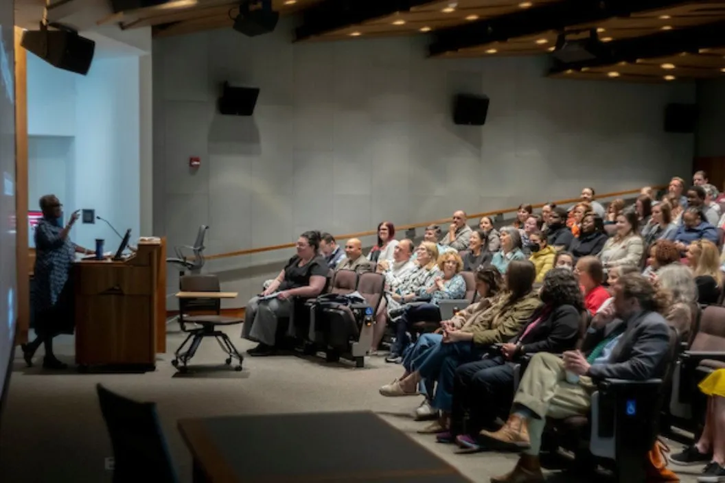 Val Smith speaks at all-staff meeting
