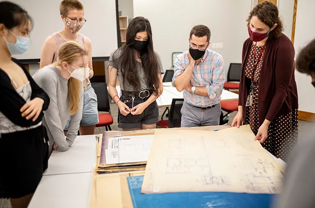 Prof. Goldstein and Curator Caust Ellenbogen teach an Art History class using materials from the Friends Historical Library