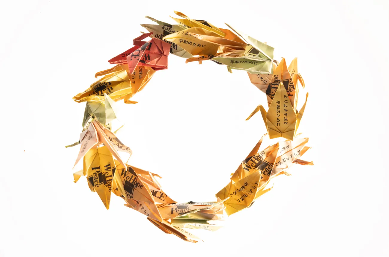 wreath made of origami cranes, symbolic of peace