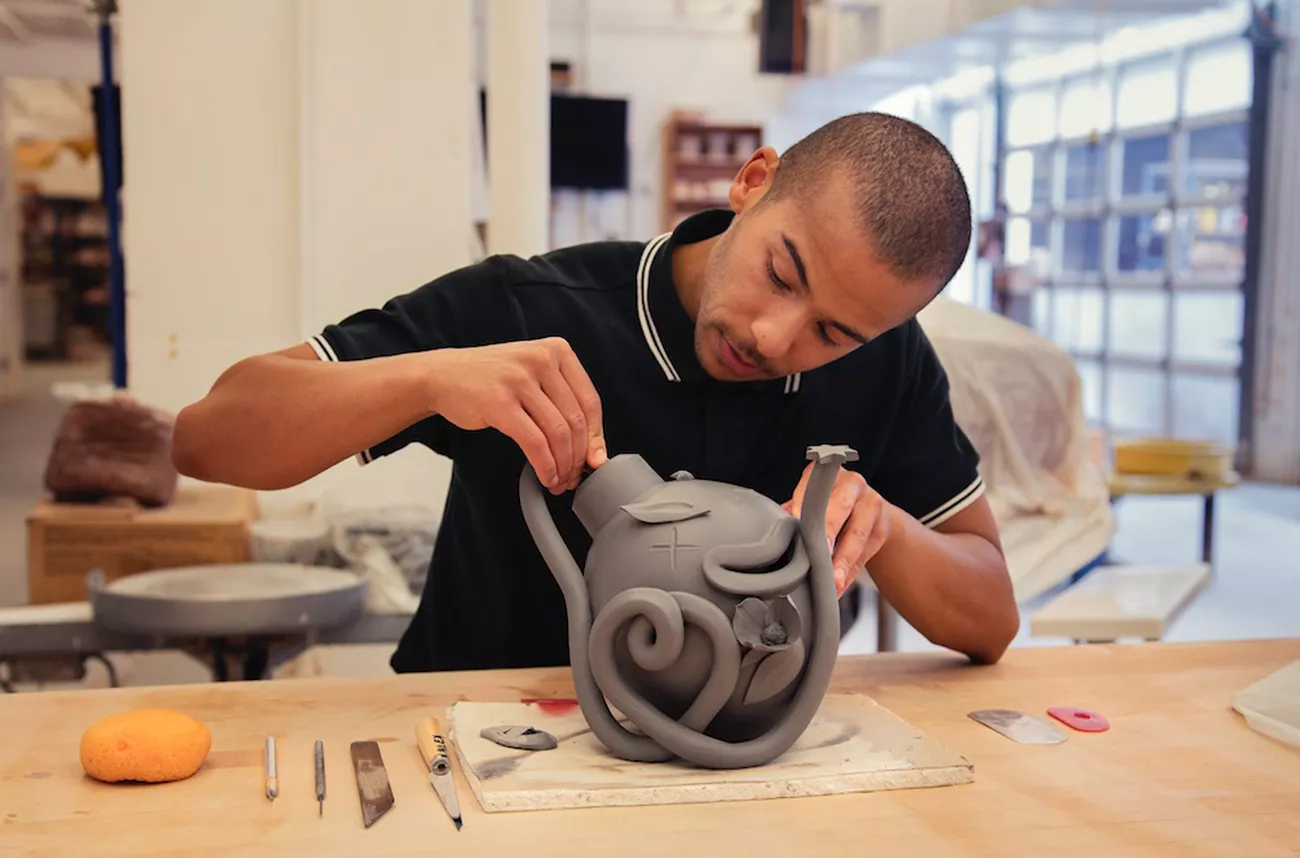 Alex Anderson working on ceramic pot
