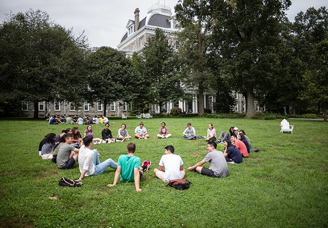 Students sit in circle on Parrish Beach