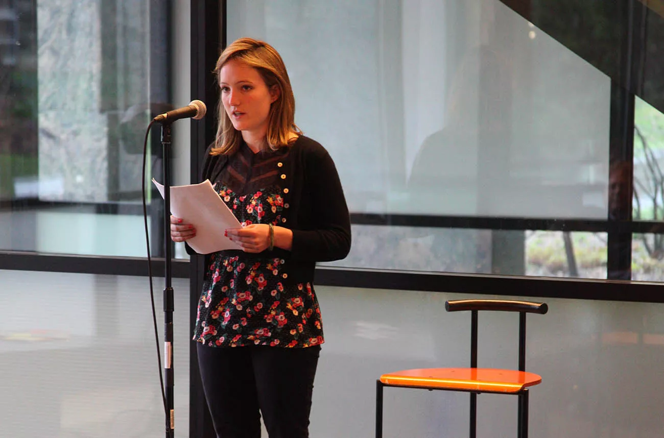 student speaking at microphone