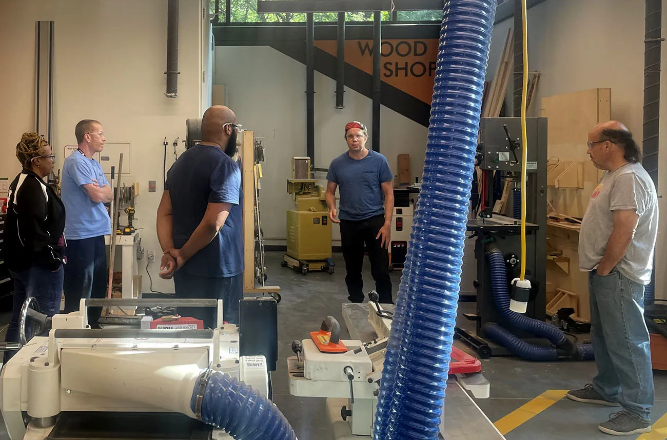 staff and faculty in wood workshop