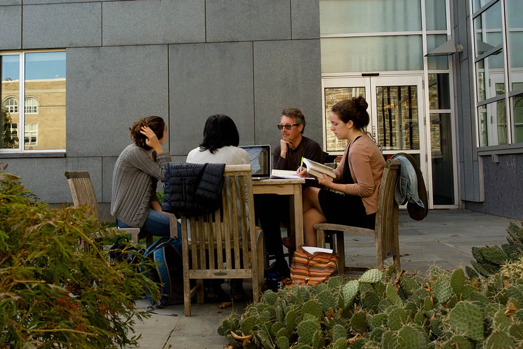 faculty and students talking