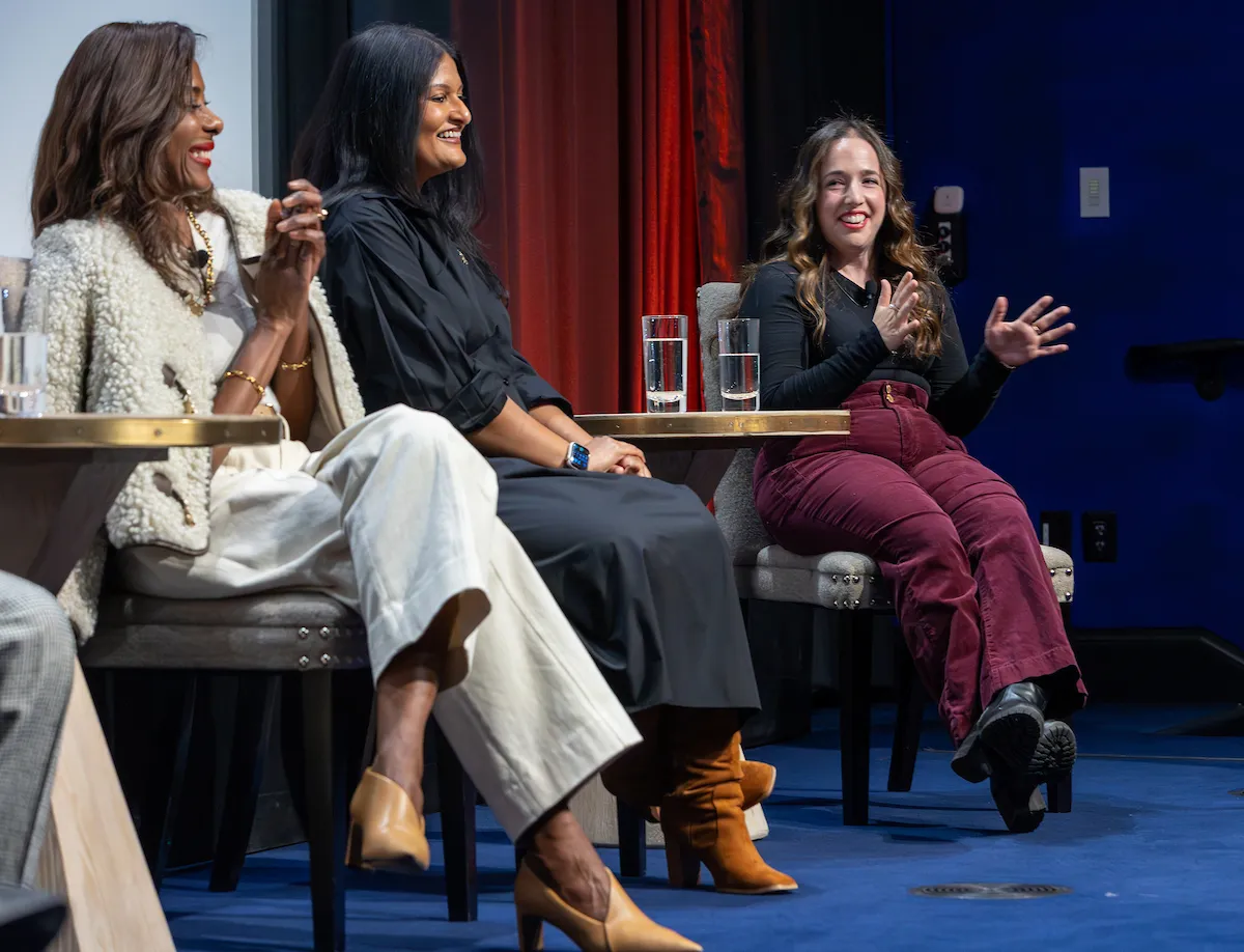 Three women on a stage 