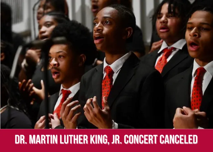 three high school boys in children's choir on stage