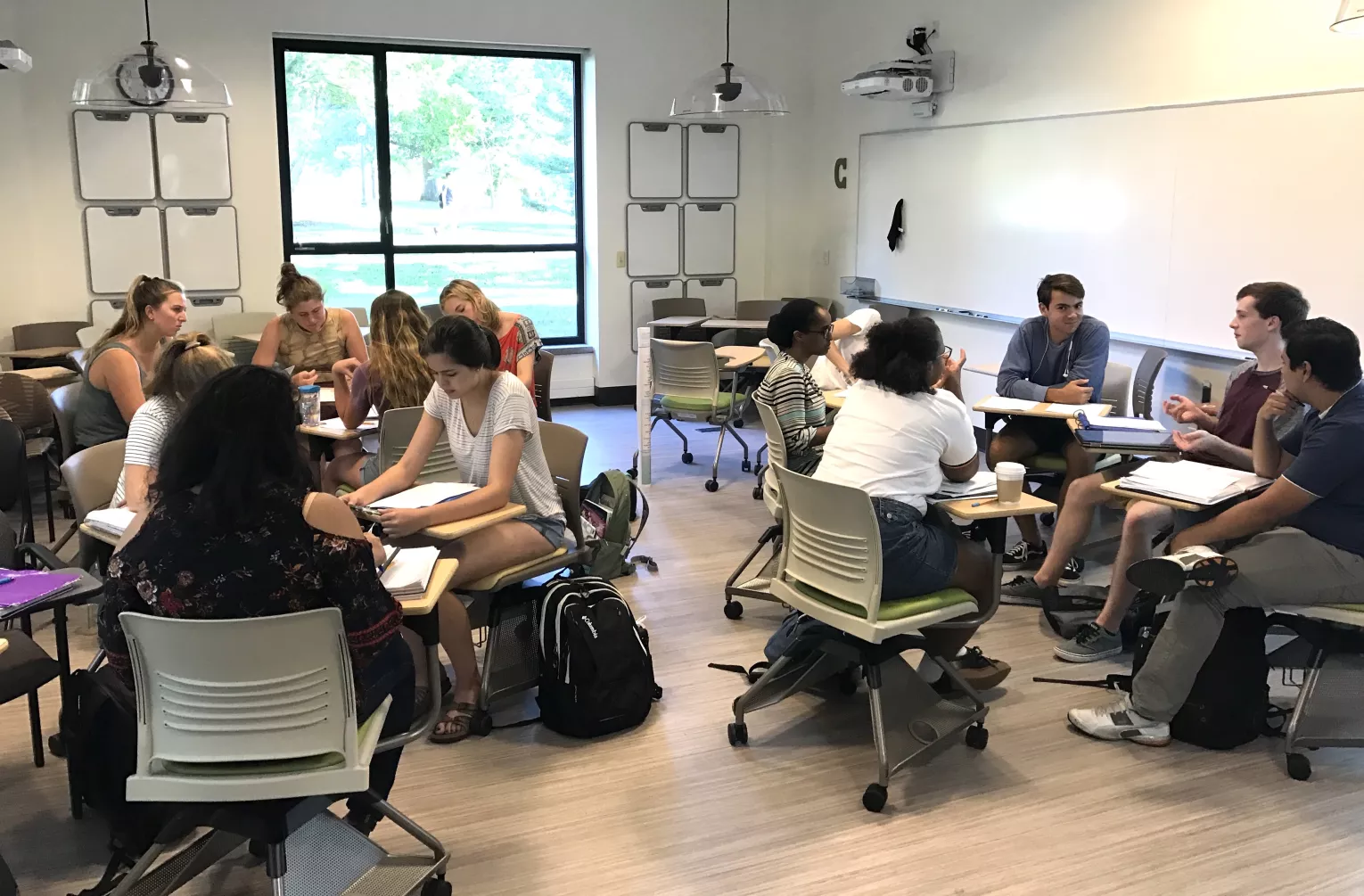 Students in a classroom sitting in groups