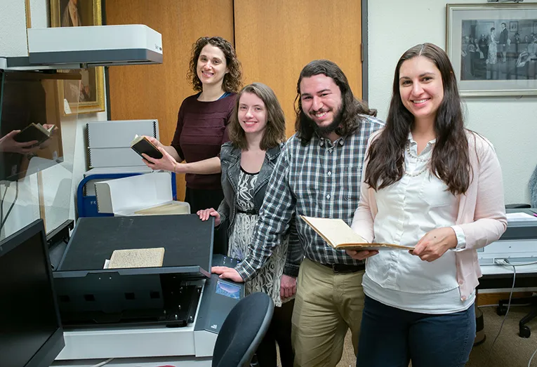 Staff and students work on scanning