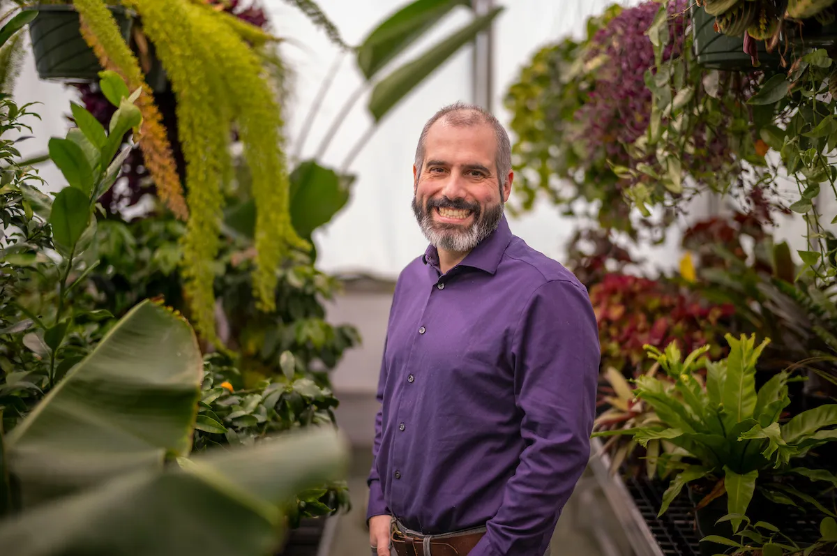 Vince formica standing in front of plants on greenhouse setting