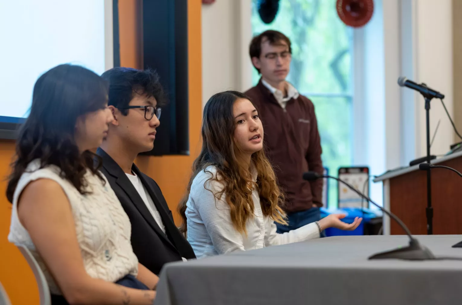 Image of students speaking on a panel