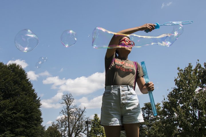 student with bubbles