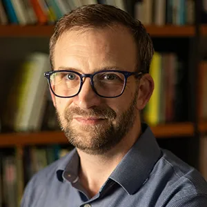 Daniel Laurison in office in front of bookcase
