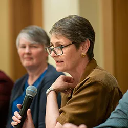 Aimee Johnson speaking at symposium