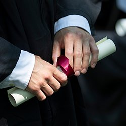 Hands hold diploma