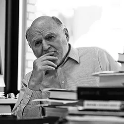 Black and white photo of Victor Navasky in his office