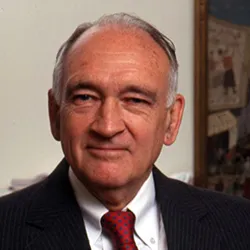 William Spock in front of painting in background