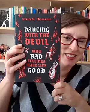 Krista Thomason with her book "Dancing with the Devil"