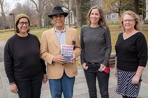 Braulio Munoz with library staff after self-published novel released