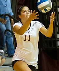 Genny Pezzola serves volleyball