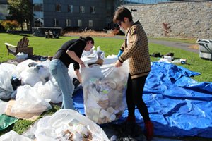 Students sort through the waste collected during the trash audit.