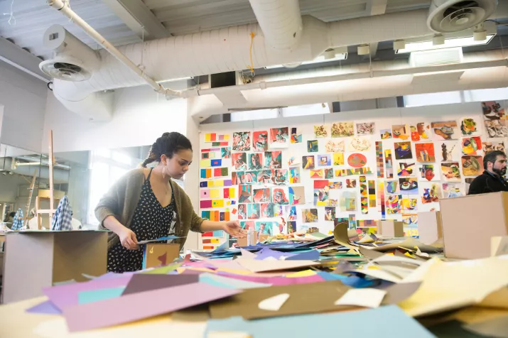 Art student working on color project inside Beardsley Hall painting studio.