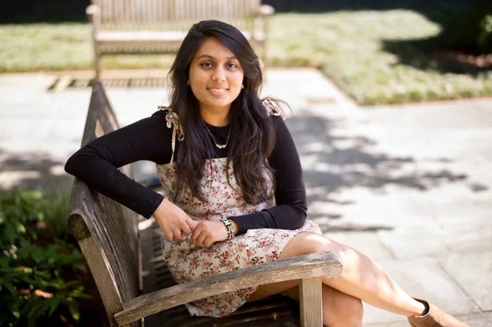 Yashvi Patel sitting on bench outside