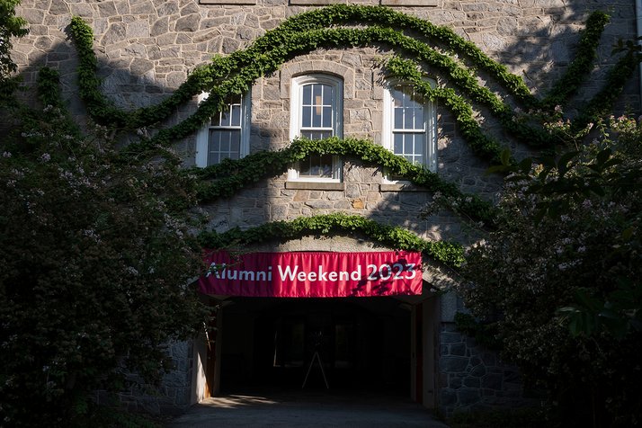 Alumni weekend banner underneath vines