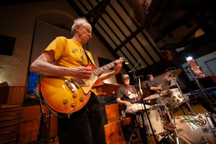 Alum plays guitar in Upper Tarble