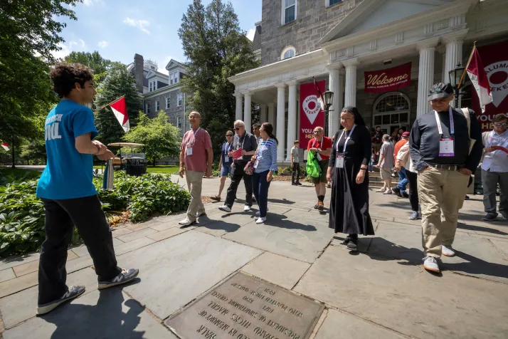 Alumni take walking tour in front of Parrish Hall