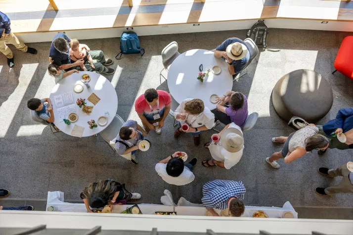 Overhead shot og alumni gathered for food and drinks