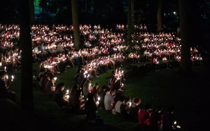 Students with candles at first collection