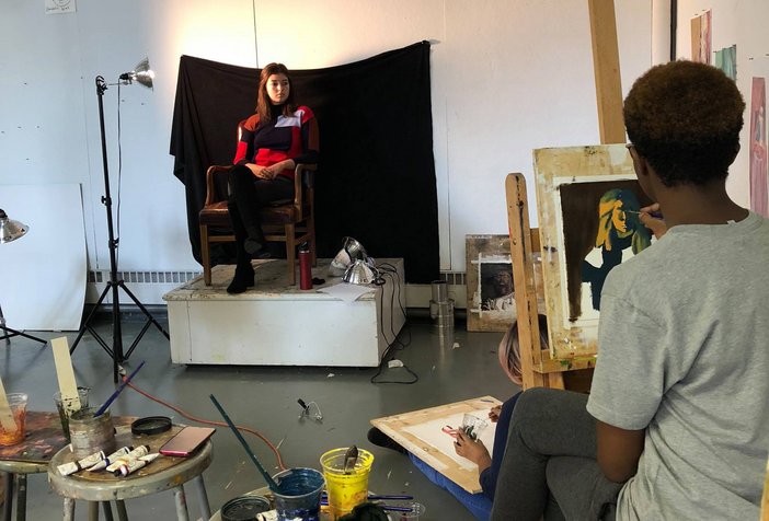 Student model poses for a painting class inside Beardsley Hall.