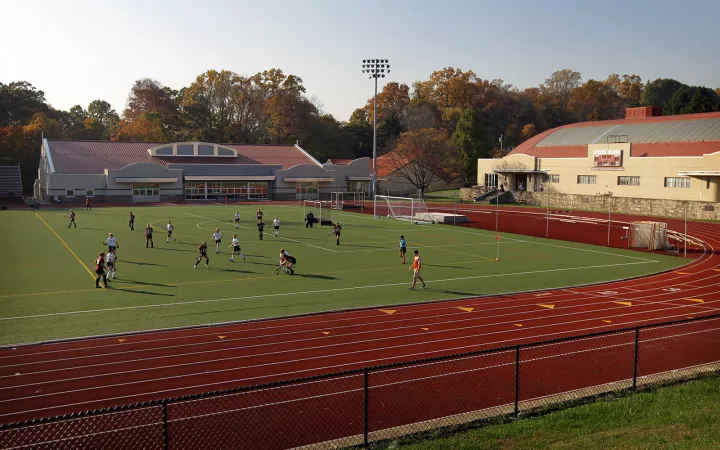 People playing on Swarthmore track inner grass 