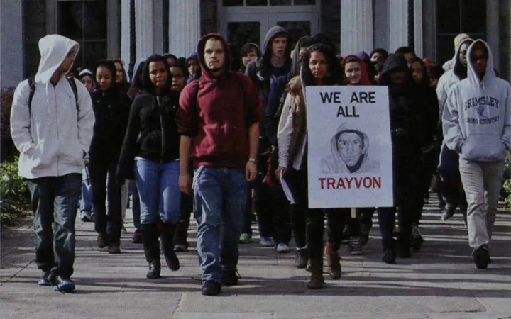 Students march with signs "We Are All Trayvon"