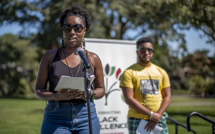 Taylor Tucker ’20 at microphone, Joe Green '21 behind