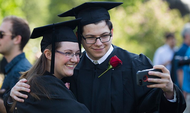 graduates posing for a selfie