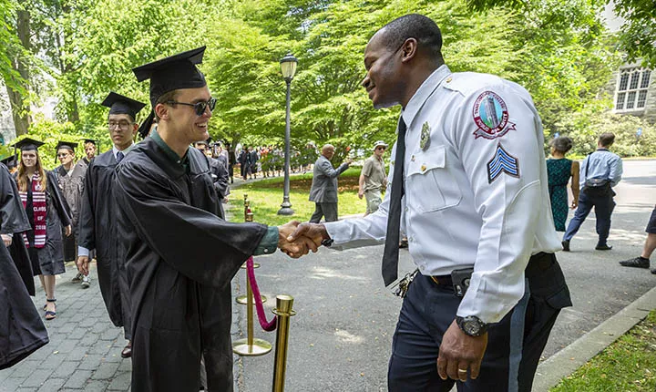 Osmond Mbaeri greets a student.