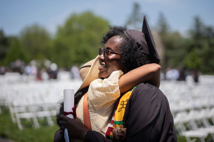 Graduates hug