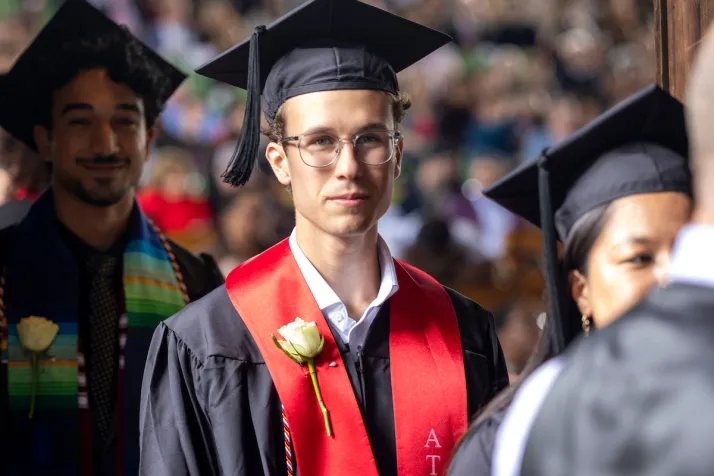 Student awaits walking across stage at commencement
