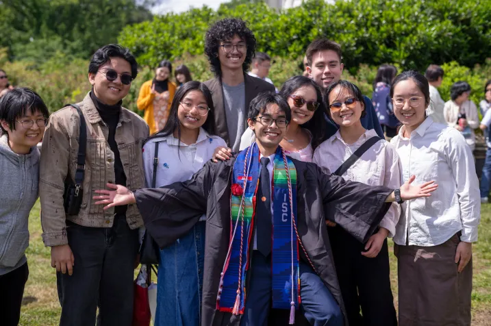 Group of students pose after commencement
