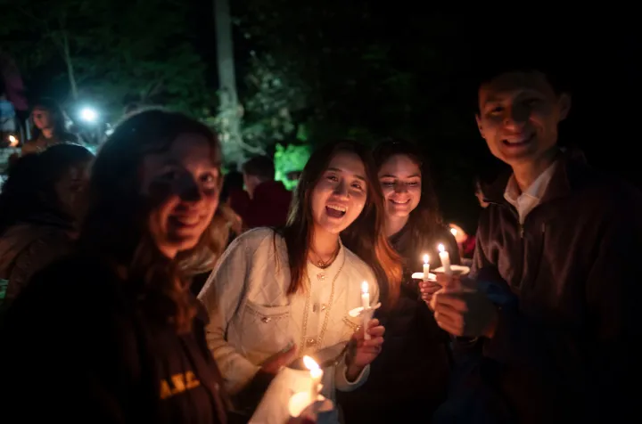 Students with candles at Last Collection