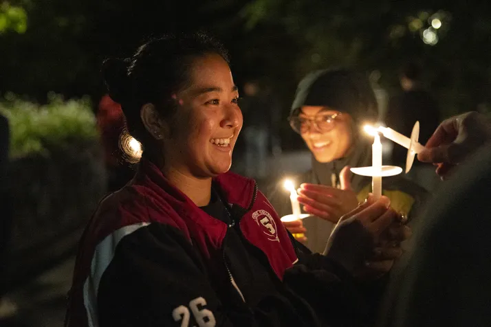 Students convene with candles for last collection ceremony