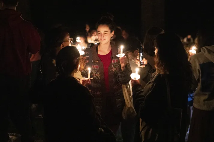 Students convene with candles for last collection ceremony