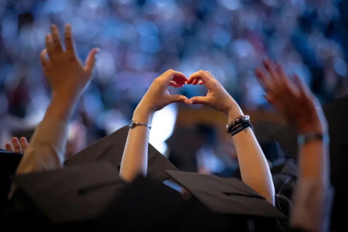 Person makes heart hands