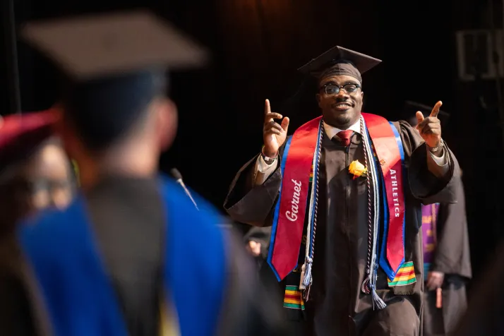 Student walks to accept diploma